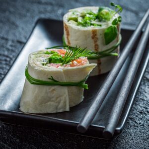 Closeup of rolls with green vegetables and herbs