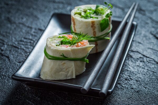 Closeup of rolls with green vegetables and herbs