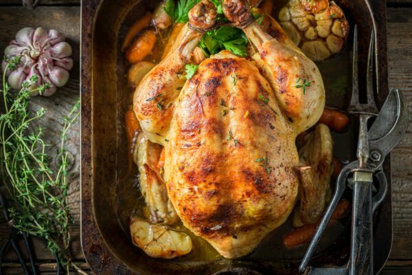 Grilled chicken with thyme and garlic. Roasted chicken with herbs.