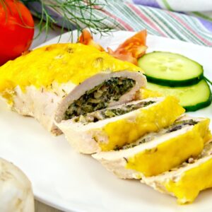 Roll chicken with mushrooms and cucumber on board