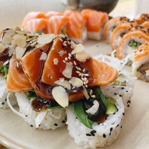 Tataki sushi with salmon,sesame seeds and almond petals.Asia food.Eating sushi at the restaurant