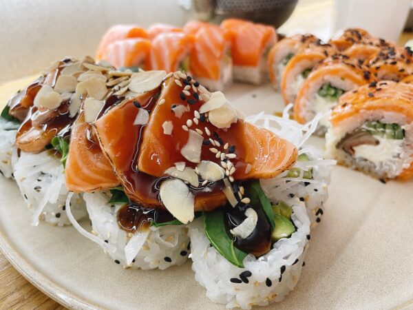 Tataki sushi with salmon,sesame seeds and almond petals.Asia food.Eating sushi at the restaurant